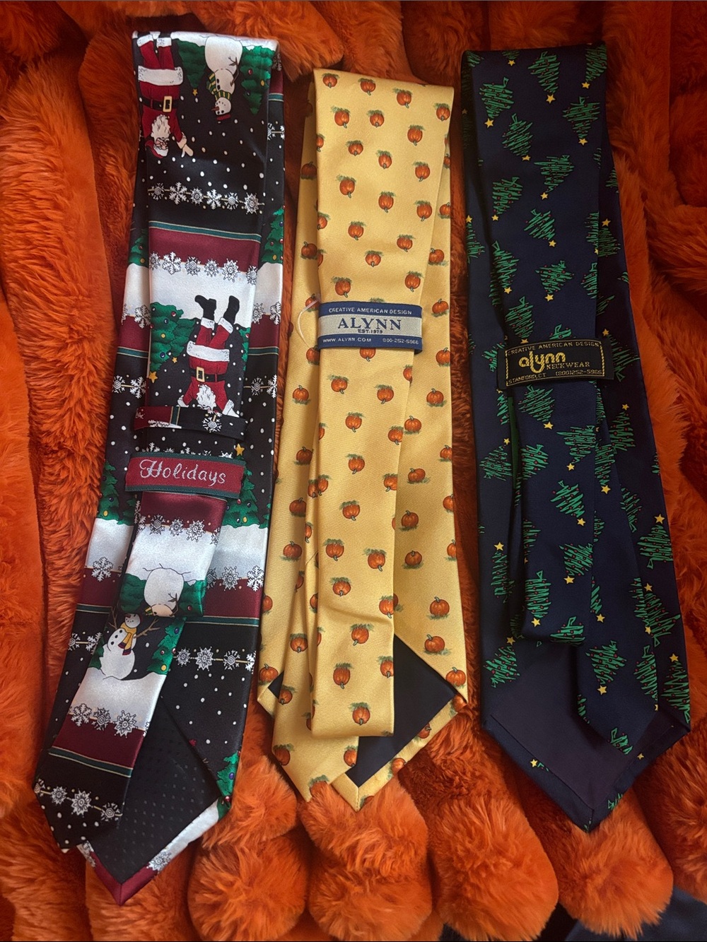 Three holiday themed Brand ties. The Santa tie plays tunes when pressed.